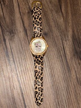 Betsey Johnson Gold-Tone Skull Watch with Leopard Print Strap